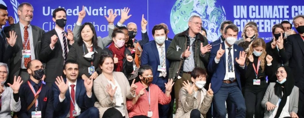 Negotiators marking the closing of the United Nations climate summit, COP26, which opened in Glasgow, Scotland, on Oct. 31. The conference sought new global commitments to tackle climate change. — courtesy UN News/Laura Quiñones
