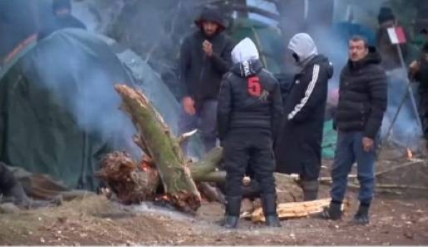 Thousands of migrants from the Middle East are camping out on the EU-Belarus border in freezing conditions.
