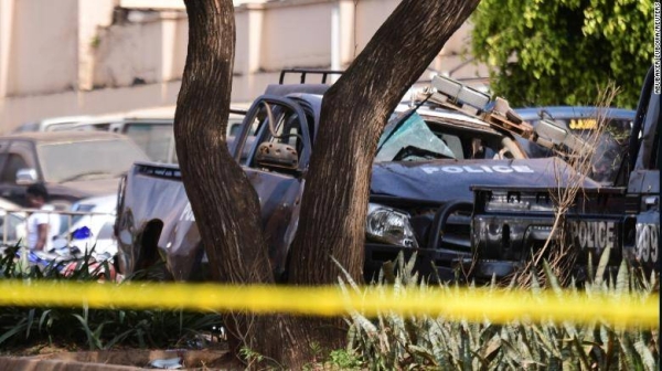 Wreckage of police vehicles at the scene of a blast in Kampala, Uganda, on Tuesday.