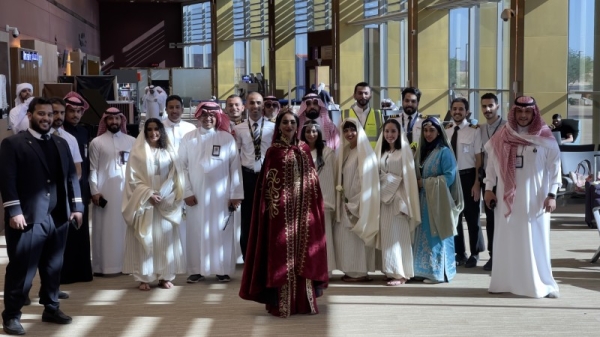 Queen Shaklith and airport officials celebrating the inagural flynas international flight in AlUla