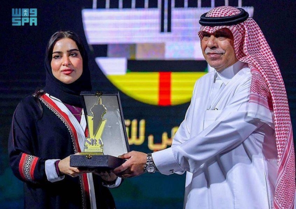 Acting Minister of Media Majid Al-Qasabi honors award winners at last month’s Arab Radio and Television Festival in Tunisia.