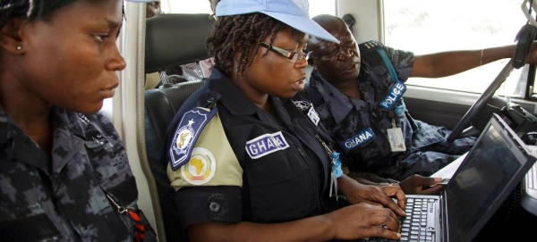 Peacekeepers write a report after patrolling an IDP camp in North Darfur, Sudan.