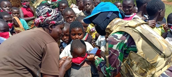 A woman peacekeeper distributes face masks at a village in Walungu in the Democratic Republic of the Congo (file photo).