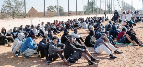 Migrants sit in the courtyard of a detention center in Libya. — courtesy (file) UNICEF/Alessio Romenzi