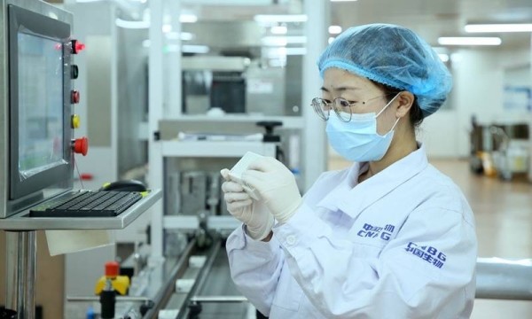 A staff member checks the packaging of the Sinopharm vaccines in Beijing, capital of China, May 31, 2021.
