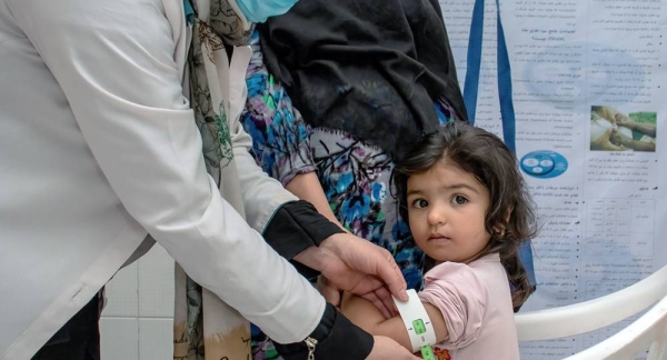 Two-year-old Fatima has her nutritional status screened at Bab-e-Bargh health center which is supported by UNICEF in Herat city's largest health clinic. — courtesy UNICEF/Sayed Bidel