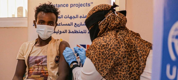 An Ethiopian migrant in Yemen receives his Covid-19 vaccine at the IOM Migrant Response Point in Aden.