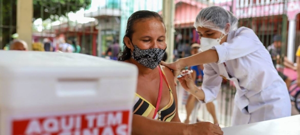 A COVID-19 vaccination campaign takes place in a riverside community in northern Brazil.