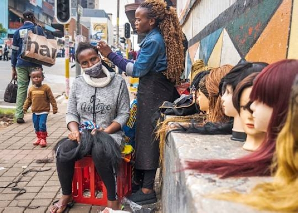 A street hairdresser in Hillbrow, Johannesburg, South Africa