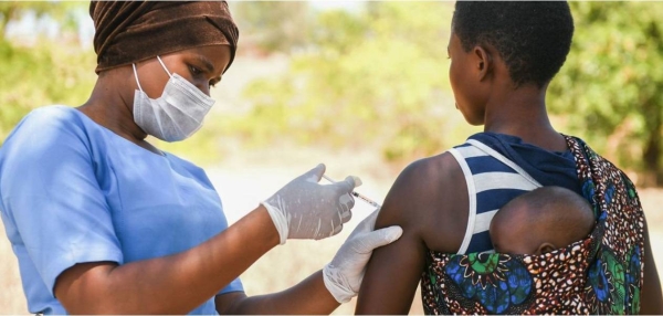 A woman is getting vaccinated in Kasungo District, Malawi