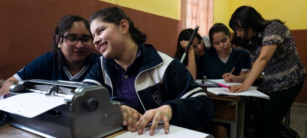 A student in her classroom in Paraguay, learning how to read and write braille.