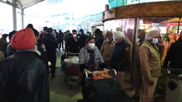 Ambulances lined up outside Amritsar airport to take the infected passengers away.