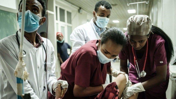 Medical staff give medical care to a young victim at the Ayder referral hospital in Mekele, the capital of the war-torn Tigray region of Ethiopia.