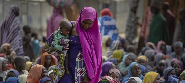 Internally displaced mothers and their children attend a WFP famine assessment in Borno State, Nigeria.