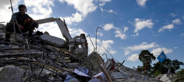 UN peacekeepers take a break while working through the rubble of the UN mission in Haiti's headquarters in Port au Prince in the aftermath of the devastating January 2010 earthquake.