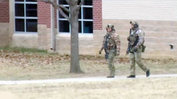 Four people who were held hostage at a synagogue in a suburb of Dallas, Texas, have been freed unharmed after a 10-hour stand-off with police.