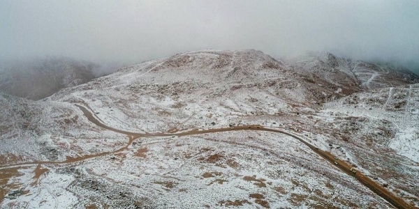 Jabal Al-Lawz is still witnessing snowfall with rain, which marks a climate phenomenon that beautifies the northern region of Tabuk at this time of every year.