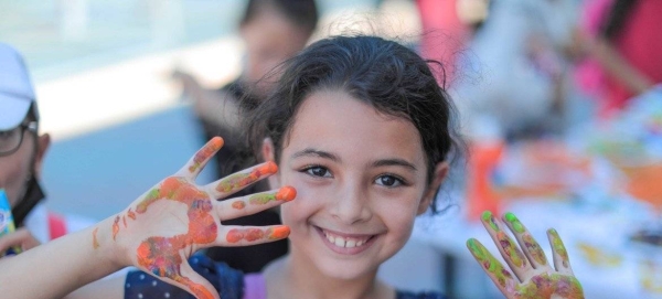 A young girl takes part in UNRWA's Keeping Kids Cool summer activities in Gaza.
