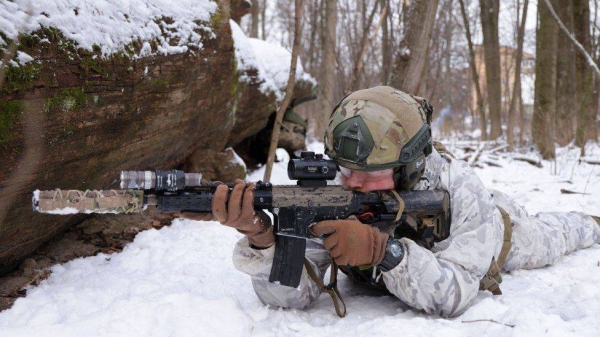 A Ukrainian civilian takes part in a training exercise.