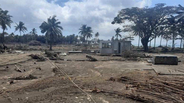 Images from Tonga's shoreline show damage to structures and trees following the tsunami