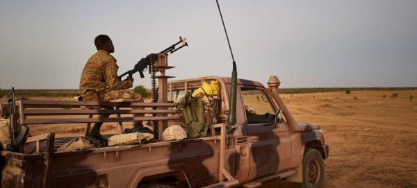 A soldier on the lookout in a desertic area in northern Burkina Faso.