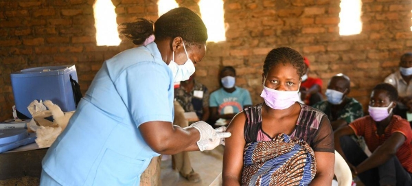 A woman receives her second dose of the COVID-19 vaccine at a church in Kasungu, Malawi.
