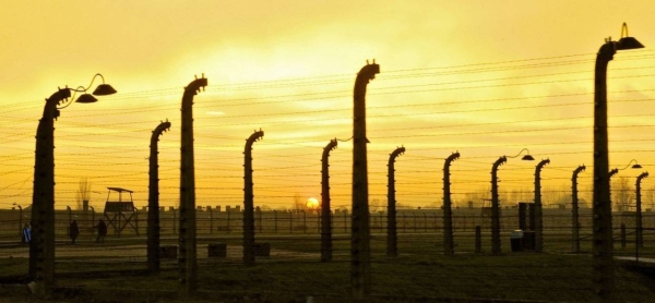 Sunset falls at Auschwitz-Birkenau concentration camp, in Poland. Auschwitz has become a symbol of terror, genocide, and the Holocaust.