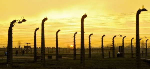 Sunset falls at Auschwitz-Birkenau concentration camp, in Poland. Auschwitz has become a symbol of terror, genocide, and the Holocaust.