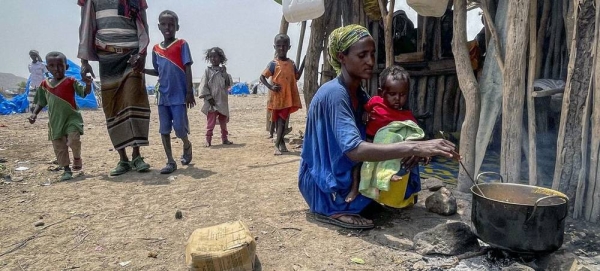 A displaced mother cooks for her family in Afar, Ethiopia. — courtesy WFP/Claire Nevill