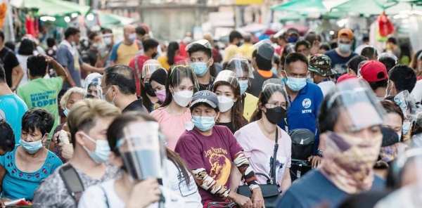 People wear facemasks during the COVID-19 pandemic in Quiapo in the Philippines. — courtesy IMF/Lisa Marie David