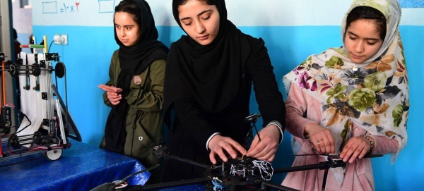 Young girls work on a robotics project in Afghanistan.