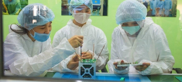 Young girls work on a robotics project in Afghanistan.