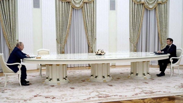 The four-meter table between Putin and Macron was widely commented upon.