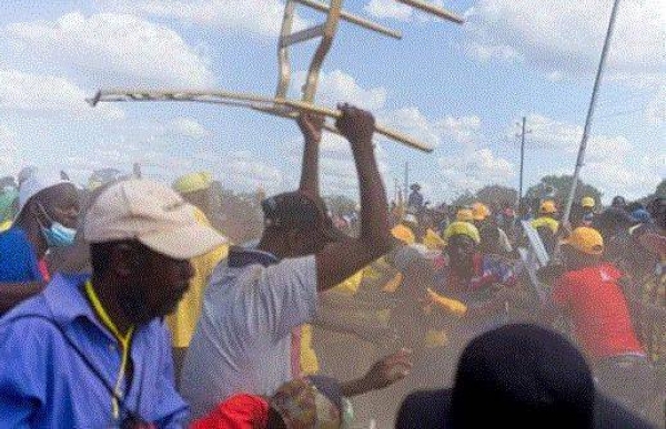 A man brandishes a chair during clashes at an opposition electoral rally in Kwekwe, central Zimbabwe, on Sunday.