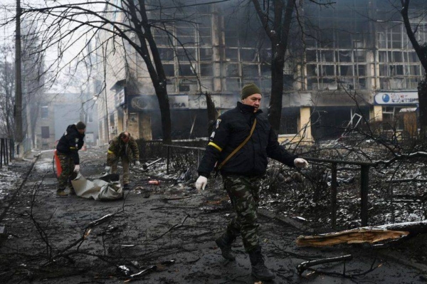 Emergency services in the aftermath of a strike on a TV tower in Kyiv on Tuesday that killed five.