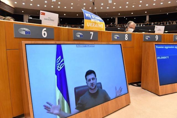 Ukraine's President Volodymyr Zelenskyy addresses the Plenary, via remote link, during an extraordinary session on Ukraine at the European Parliament in Brussels.