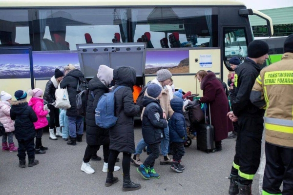 Refugees from Ukraine arrive in Poland at the Medyka border crossing.