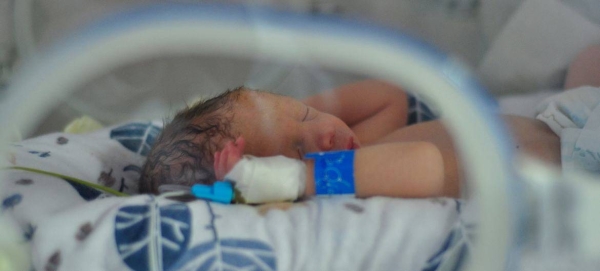 A newborn baby lies in an incubator at a maternity ward that was moved to the basement of a hospital in Kyiv, Ukraine.