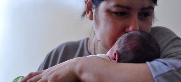 A mother holds her newborn at a hospital in Kyiv, Ukraine.