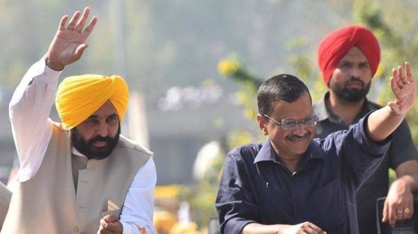 Aam Aadmi Party (AAP) national convener Arvind Kejriwal with Punjab chief minister-designate Bhagwant Mann during a road show to thank voters for the party’s victory in Punjab assembly election on March 13, 2022 in Amritsar, India.