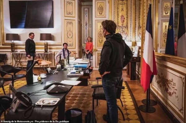 The French leader is barely recognisable upon first glance at the images, his baggy black hoodie a stark departure from his preferred slim navy jacket. 