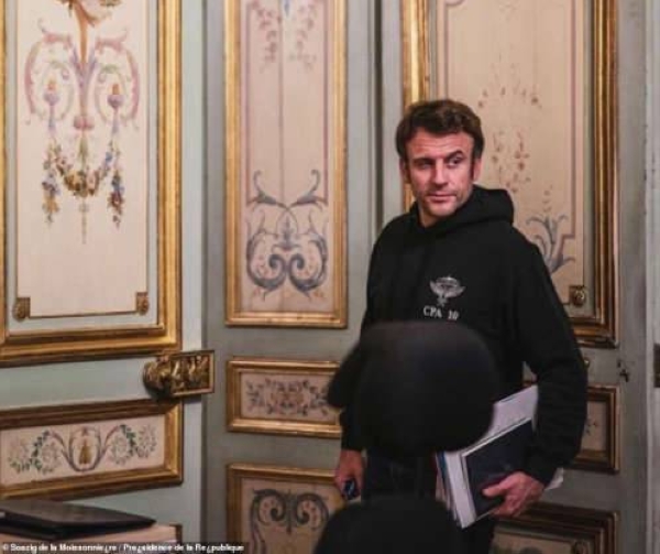 The French leader is barely recognisable upon first glance at the images, his baggy black hoodie a stark departure from his preferred slim navy jacket. 