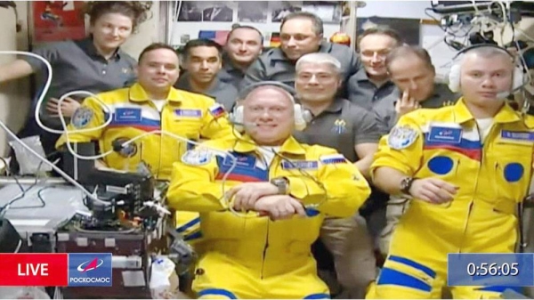The first arrivals since Russia's war began were shown wearing bright yellow suits with blue trimmings.