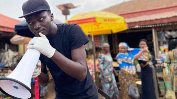 Gbenga Adewoyin in a market of Ibadan.