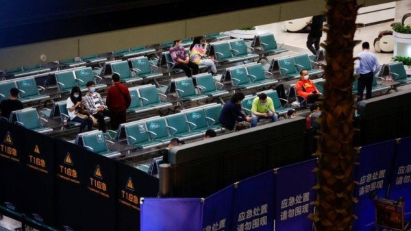 Relatives waiting for news of their loved ones at Guangzhour Airport on Monday night.
