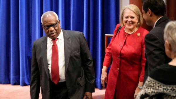 Virginia Thomas with her husband, Supreme Court Judge Clarence Thomas (left).