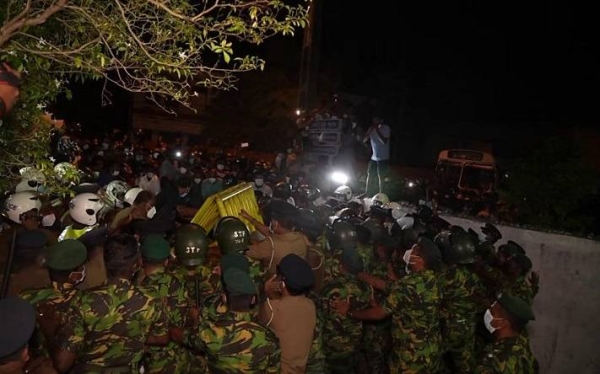 People clash with the police during a protest against the current economic crisis, outside the President