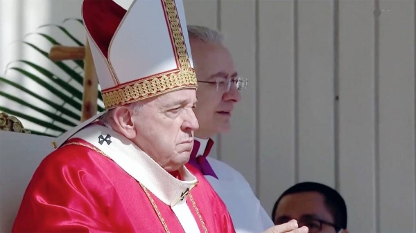 Pope Francis celebrates Palm Sunday Mass in St. Peter's Square at the Vatican, Sunday.