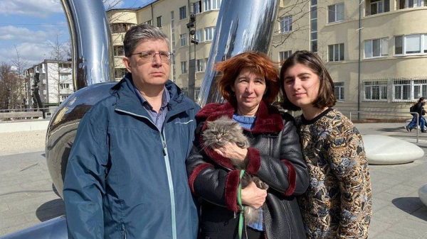 Dmitri, Oksana and Anastasia Pavlova after the rescue from Mariupol.

