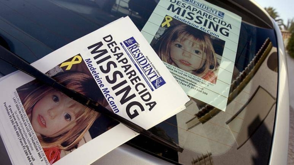 The apartment where British girl Madeleine McCann disappeared one year ago is seen with her picture on a windscreen Saturday May 3, 2008 at Praia da Luz beach, Lagos, Portugal.